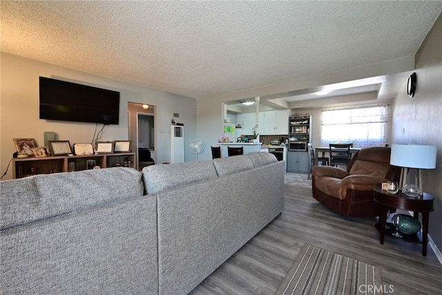 428 N Garfield Ave, Alhambra, CA 91801 - living room with a textured ceiling and wood finished floors
