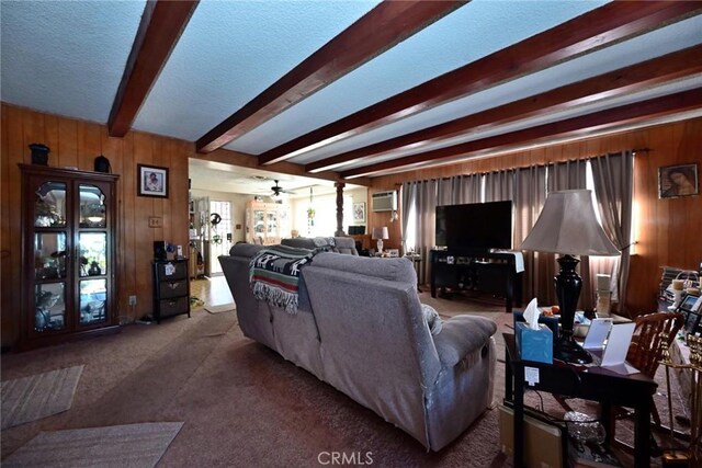 428 N Garfield Ave, Alhambra, CA 91801 - living area featuring a wall unit AC, wood walls, a textured ceiling, ceiling fan, and beamed ceiling