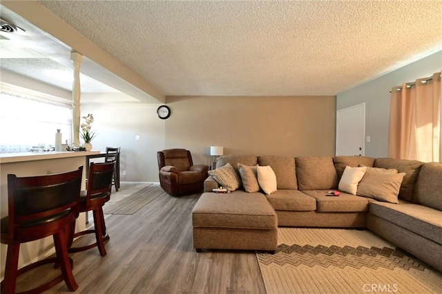 428 N Garfield Ave, Alhambra, CA 91801 - living area with a textured ceiling, wood finished floors, and baseboards