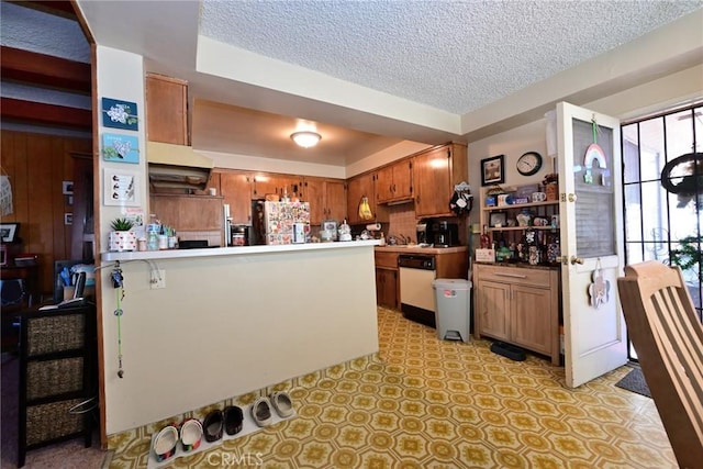 428 N Garfield Ave, Alhambra, CA 91801 - kitchen with freestanding refrigerator, brown cabinets, dishwasher, and a peninsula