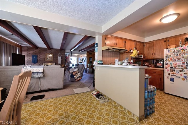 428 N Garfield Ave, Alhambra, CA 91801 - interior space with beam ceiling, brown cabinets, freestanding refrigerator, open floor plan, and a textured ceiling