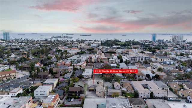 aerial view featuring a water view and a city view