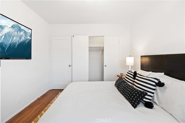 bedroom featuring a closet and wood finished floors