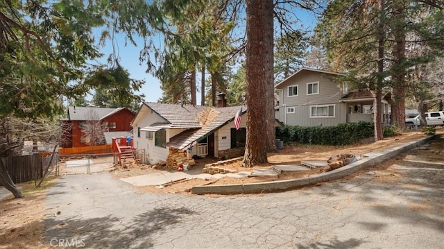 view of front of property featuring fence