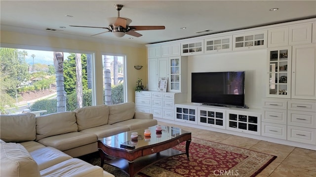 living room featuring crown molding, visible vents, and ceiling fan