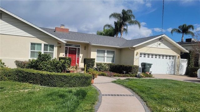 single story home featuring concrete driveway, a front yard, stucco siding, a chimney, and an attached garage