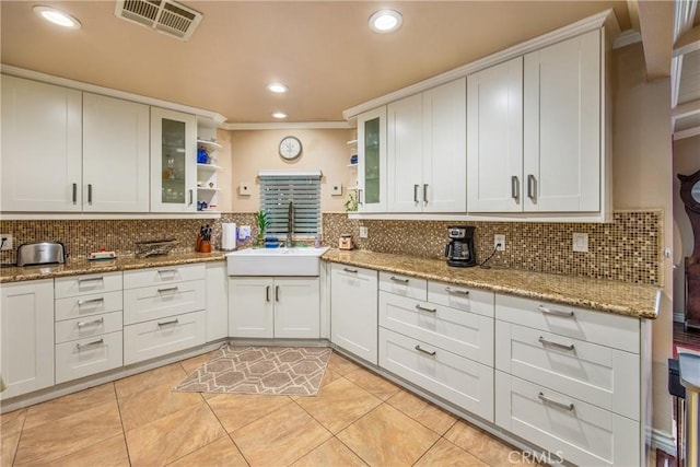 929 E Foothill Unit 161, Upland, CA 91786 - kitchen featuring tasteful backsplash, visible vents, and a sink