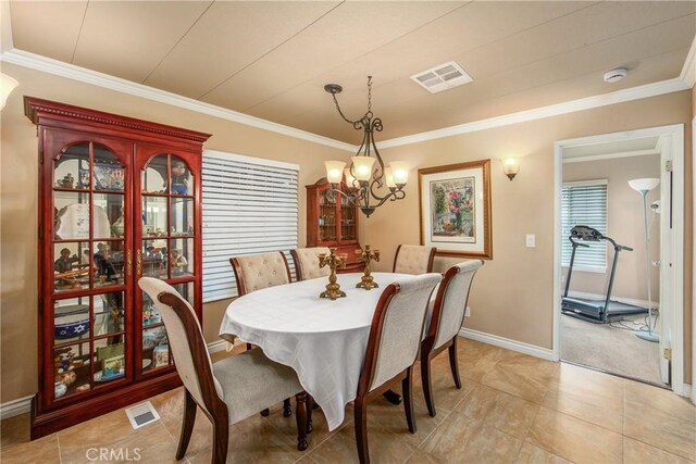 929 E Foothill Unit 161, Upland, CA 91786 - dining area featuring baseboards, visible vents, and crown molding