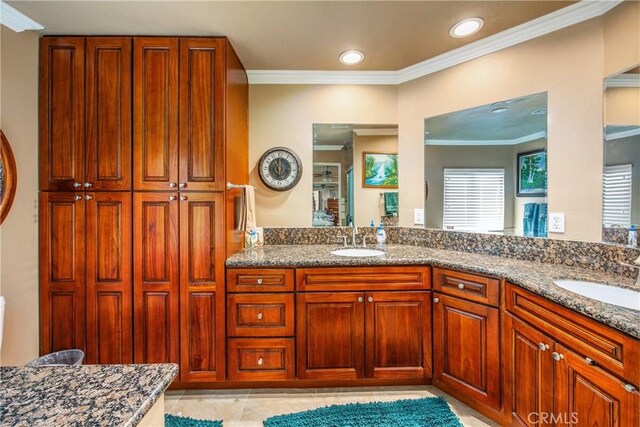 929 E Foothill Unit 161, Upland, CA 91786 - full bathroom featuring double vanity, ornamental molding, and a sink