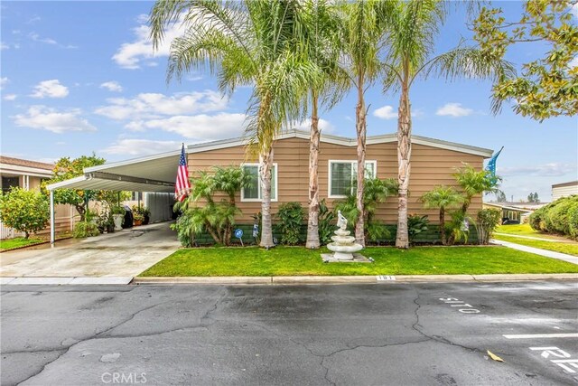 929 E Foothill Unit 161, Upland, CA 91786 - manufactured / mobile home with a front lawn and a carport