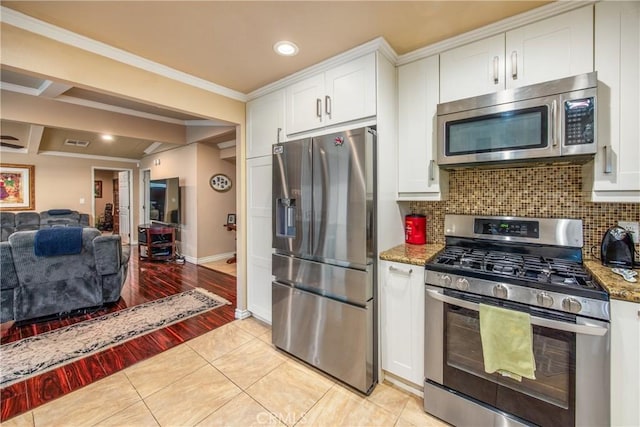 929 E Foothill Unit 161, Upland, CA 91786 - kitchen with stainless steel appliances, light stone counters, white cabinets, and tasteful backsplash