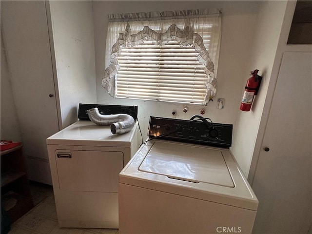 clothes washing area featuring laundry area and washing machine and dryer