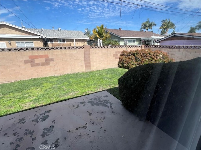 view of yard featuring a patio and fence