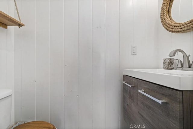 half bath with vanity and toilet