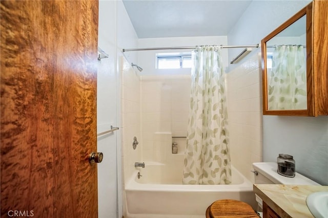 full bathroom with toilet, vanity, and shower / bath combo