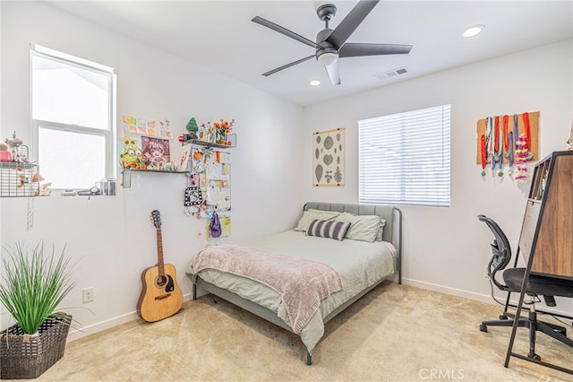 bedroom featuring light carpet, visible vents, recessed lighting, and baseboards