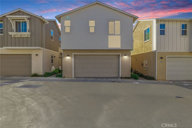 view of front of house featuring stucco siding and an attached garage