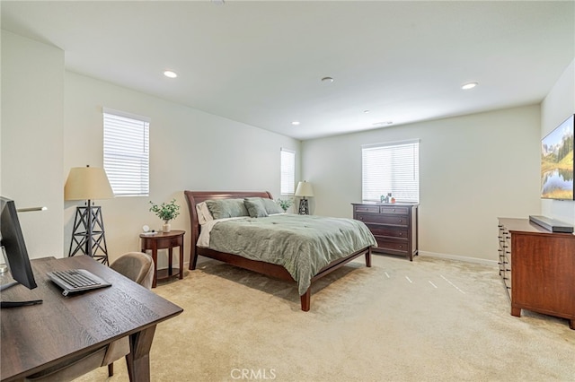 bedroom with light carpet, recessed lighting, and baseboards