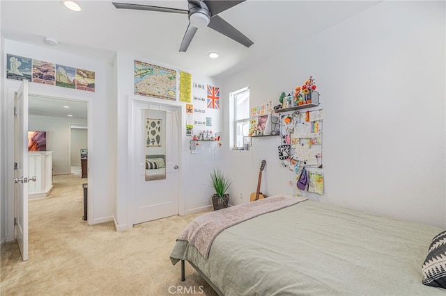 bedroom featuring recessed lighting, baseboards, light colored carpet, and ceiling fan