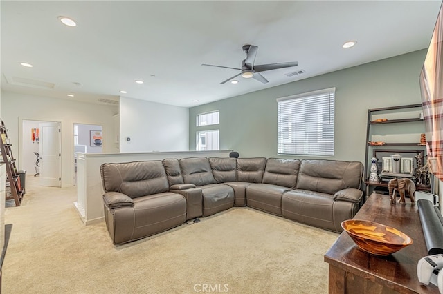 living room with a ceiling fan, recessed lighting, light colored carpet, and visible vents