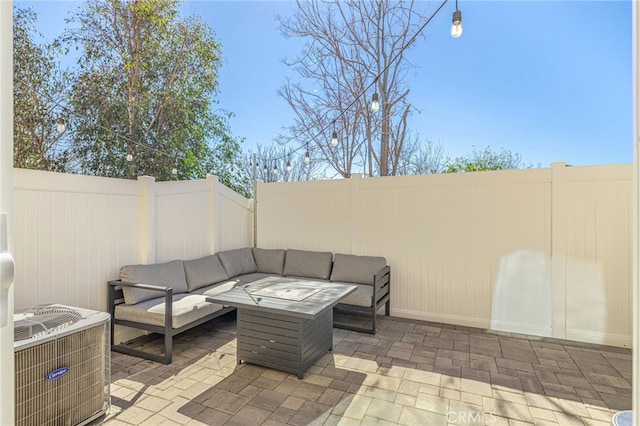 view of patio with central AC unit, an outdoor living space, and a fenced backyard