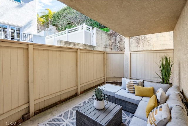 view of patio / terrace featuring a fenced backyard and an outdoor living space