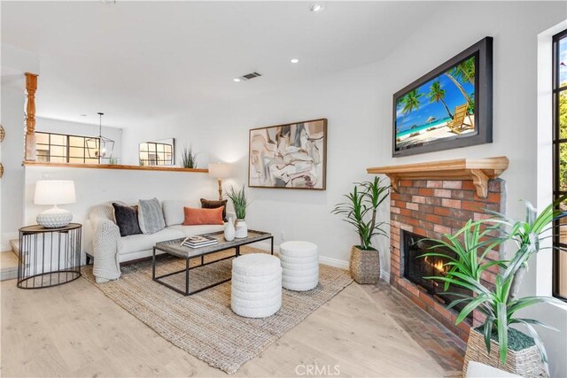 2008 Mathews Ave Unit C, Redondo Beach, CA 90278 - living area featuring wood finished floors, a fireplace, recessed lighting, and a chandelier