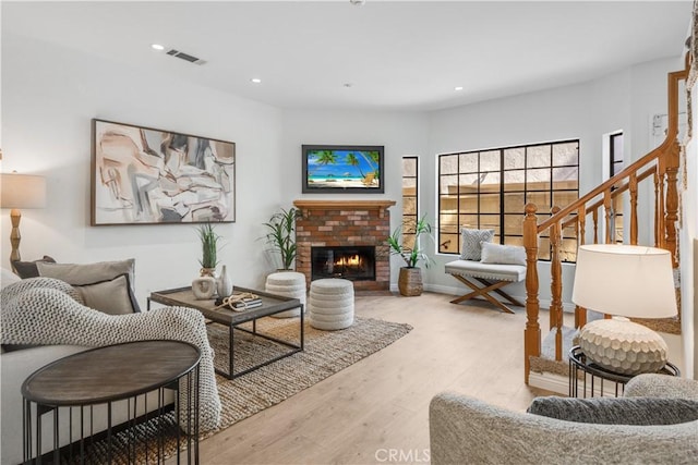 2008 Mathews Ave Unit C, Redondo Beach, CA 90278 - living room featuring wood finished floors, stairway, a brick fireplace, and recessed lighting