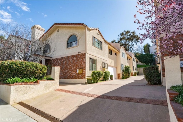 2008 Mathews Ave Unit C, Redondo Beach, CA 90278 - view of front of house with stucco siding and a chimney