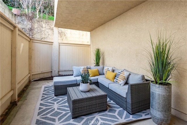 view of patio / terrace with an outdoor hangout area and fence