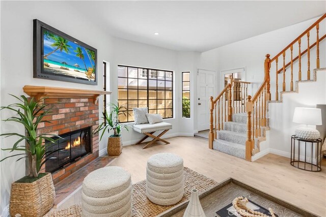 2008 Mathews Ave Unit C, Redondo Beach, CA 90278 - living area featuring stairs, wood finished floors, a brick fireplace, and recessed lighting