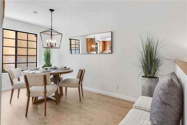 2008 Mathews Ave Unit C, Redondo Beach, CA 90278 - dining room with a chandelier and light wood-style floors