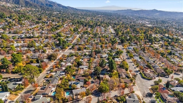 birds eye view of property featuring a mountain view and a residential view