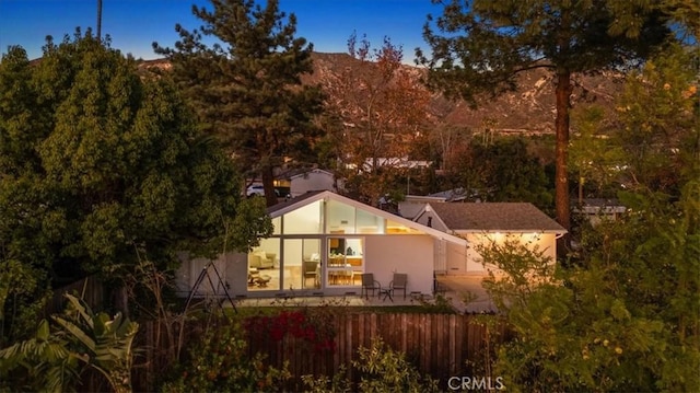 rear view of property with fence