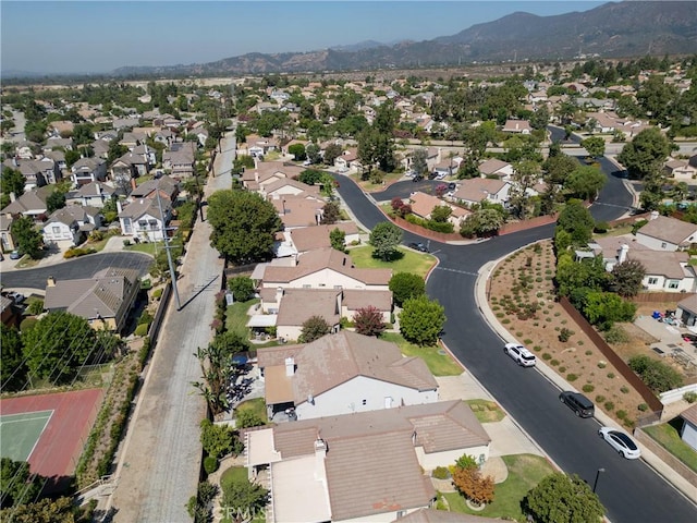 birds eye view of property with a residential view and a mountain view