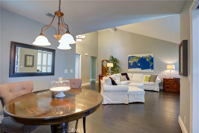 dining room featuring dark wood-style flooring, a notable chandelier, visible vents, high vaulted ceiling, and baseboards