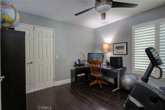 office space with wood finish floors, ceiling fan, and baseboards