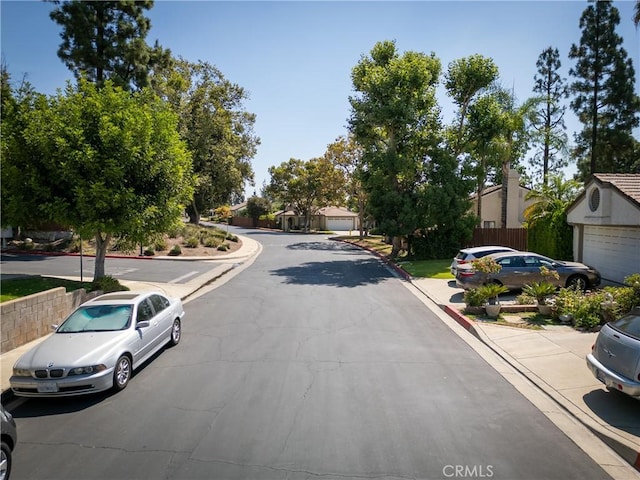 view of road with curbs and sidewalks