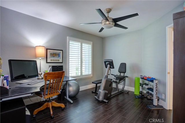 office area with baseboards, a ceiling fan, and wood finished floors