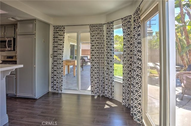 doorway to outside featuring wood finish floors and visible vents