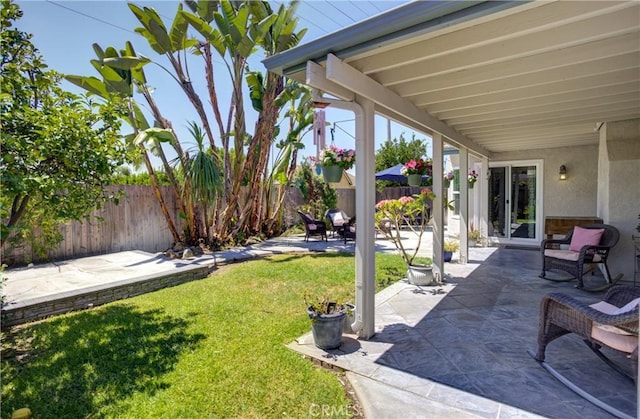 view of yard with a patio area and a fenced backyard