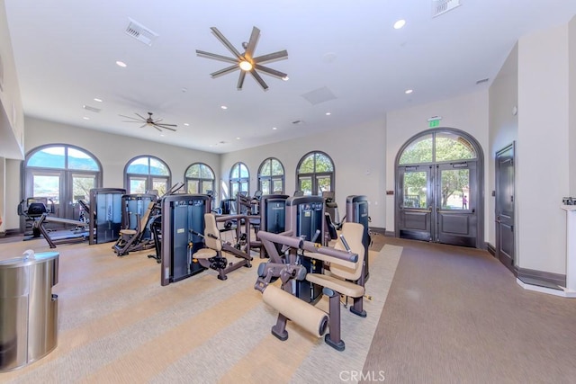 exercise room featuring baseboards, french doors, visible vents, and recessed lighting