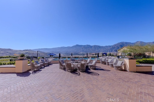 exterior space featuring outdoor dining area and a mountain view