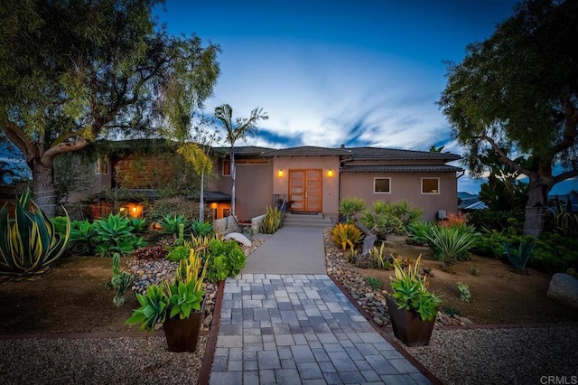 view of front of home featuring stucco siding