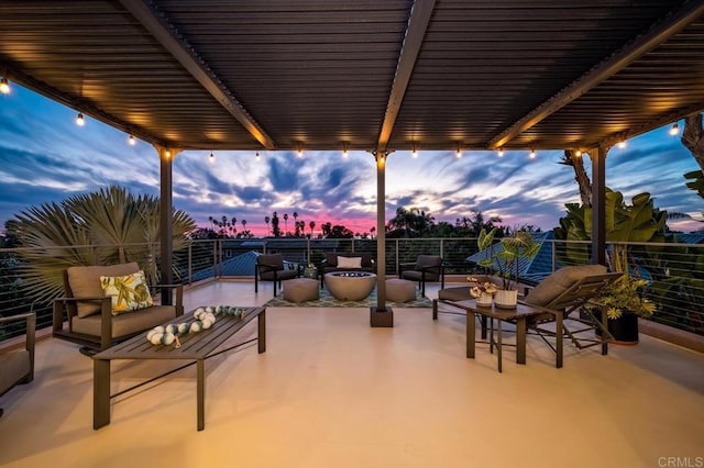 view of patio / terrace with a pergola and a balcony