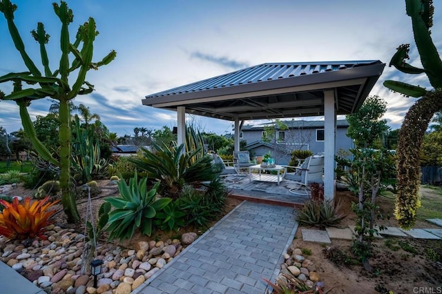 view of patio with a deck and a gazebo