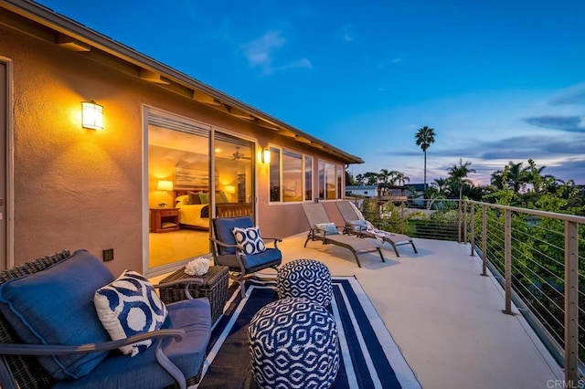 patio terrace at dusk with a balcony