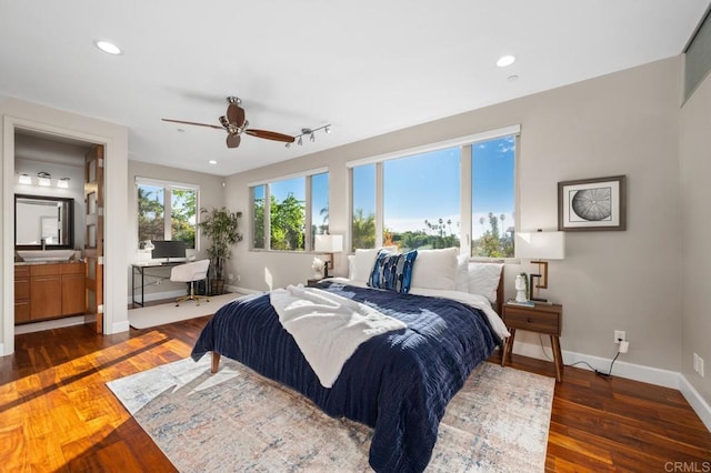bedroom with baseboards, recessed lighting, and wood finished floors