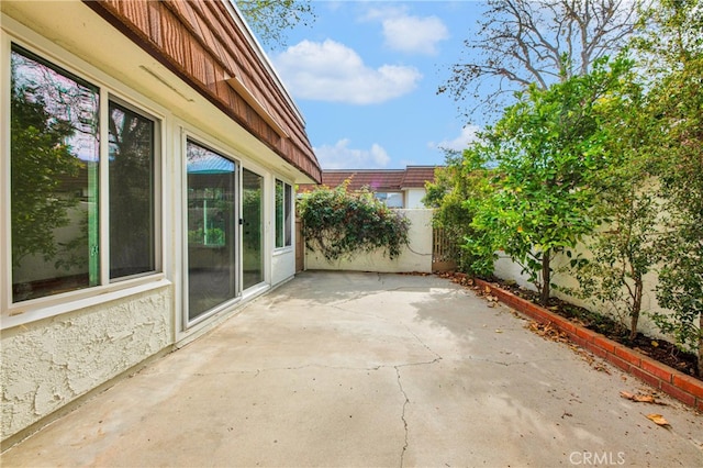 view of patio / terrace featuring fence