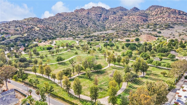 birds eye view of property with a mountain view